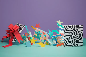 Gift box with Dabble & Dollop holiday products spilling out