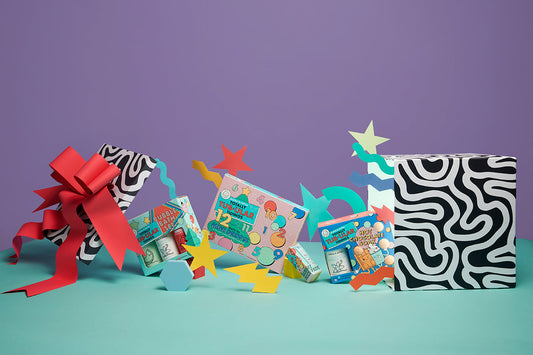 Gift box with Dabble & Dollop holiday products spilling out