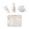 The Dabble & Dollop Infant Bundle is a limited edition set featuring EWG Verified, fragrance-free baby wash in a white tube and pump bottle, plus a bath pouf, all in a clear beige-trimmed pouch with playful branding and illustrations.