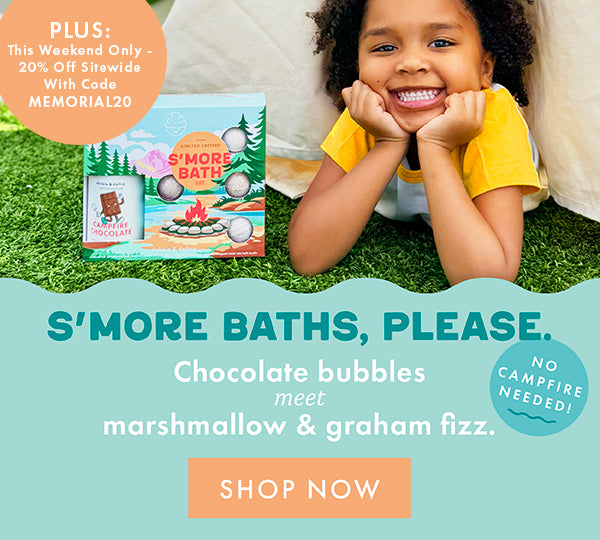 Child with a 'S'more Bath' product on grass, promotional text overlay