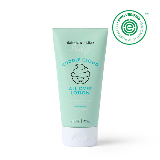 A light green 5 fl oz (142 ml) tube of Dabble & Dollop Cuddle Cloud™ All Over Lotion, featuring a cloud and baby face graphic and an EWG Verified seal, made with natural ingredients—perfect for babies.