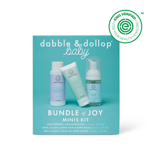A Dabble & Dollop Bundle of Joy Minis Kit box with three travel-size baby care products is shown against a teal background. The EWG Verified seal appears in the top right corner.