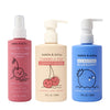 Three bottles of dabble & dollop: Detangler and Conditioner with cherry (pink spray), Conditioner with cherry (beige), and All Natural Blueberry Bubble Bath (blue), each featuring cute fruit illustrations.