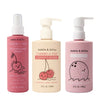 Three Dabble & Dollop bottles: pink Cherry Detangler, pale pink Cherry Conditioner, and light pink Coconut Bubble Bath, each with cute fruit characters on the packaging.