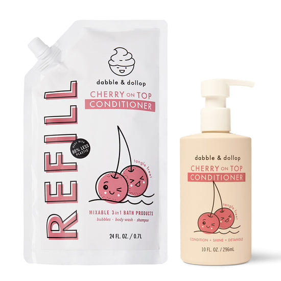 Two Dabble & Dollop Cherry on Top Conditioner products—a 24 fl oz white refill pouch with cartoon cherries, and a 10 fl oz pump bottle with an orange label and matching design.