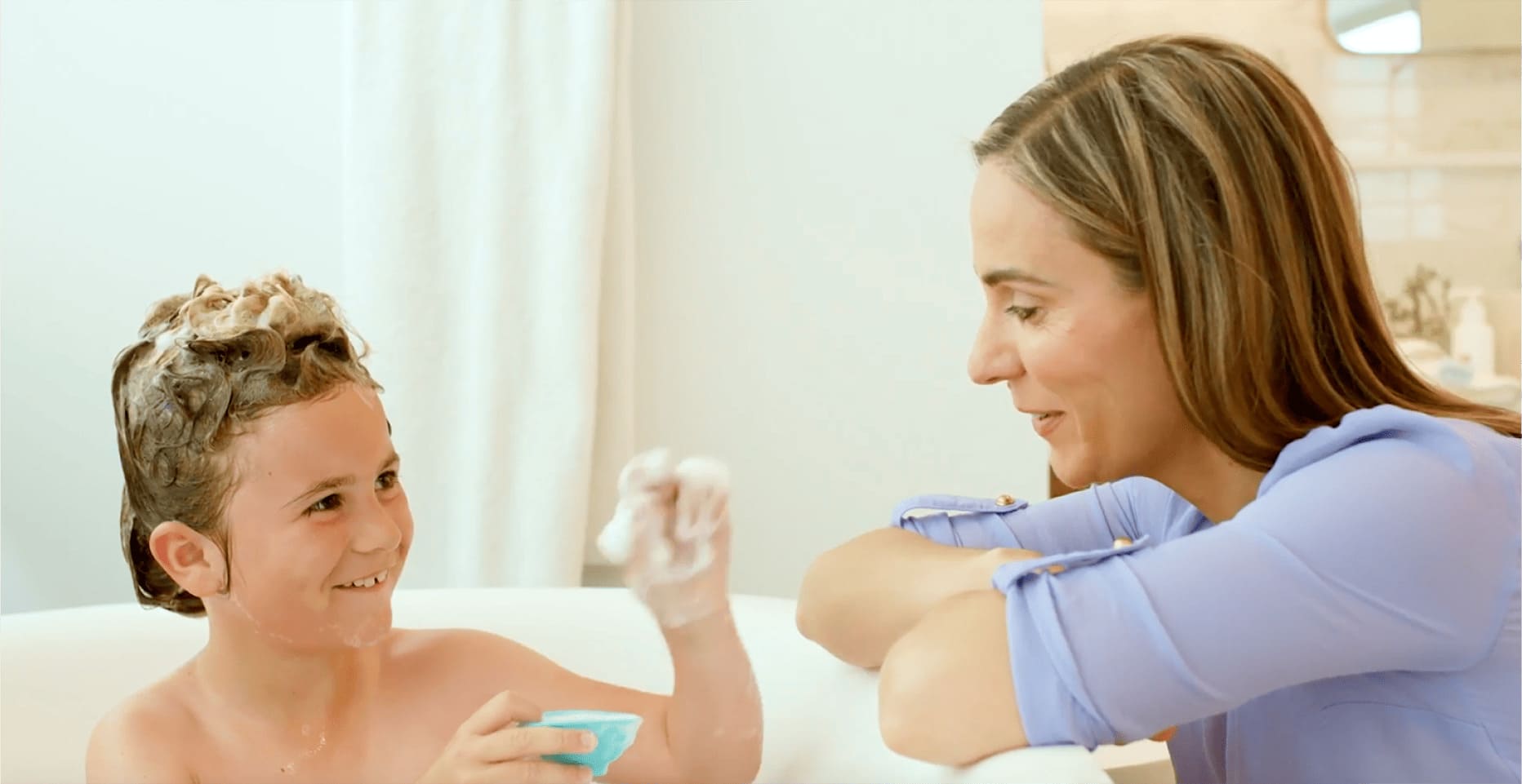 mother with son at bathtime