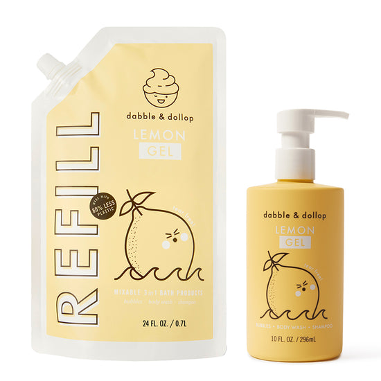 A yellow eco refill pouch labeled “Lemon Refill” and a matching pump bottle from Dabble & Dollop, both featuring a cute lemon illustration, promote their mixable 3-in-1 lemon bubble bath products.