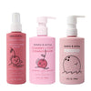 Three pink Dabble & Dollop bottles—Detangler and Conditioner with playful fruit illustrations and pump or spray tops—stand against a white background.