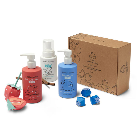 Dabble & Dollop Americana Bath Bundle gift set includes Strawberry Gel, Blueberry Gel, and Vanilla Whip bottles in a brown box decorated with charming paper fruit and flower models.