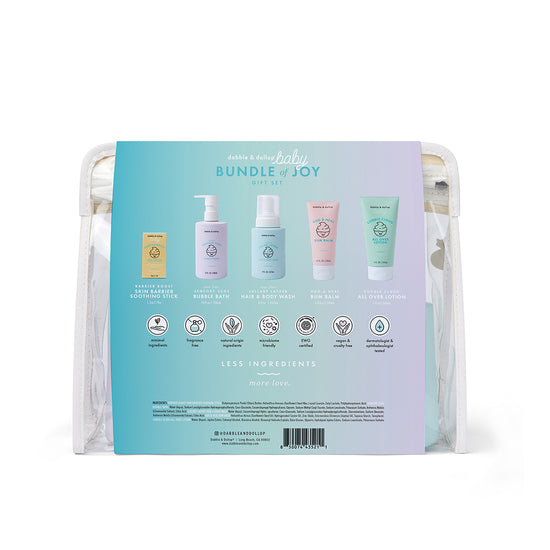 A clear pouch holds the Dabble & Dollop Bundle of Joy Gift Set, featuring five pastel-colored, fragrance-free baby care products with gentle skin care details for each item printed on the packaging.