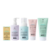 Five Dabble & Dollop Bundle of Joy Gift Set baby skincare products are arranged in yellow, white, light blue, pink, and green packaging with cute graphics. This fragrance-free set is perfect for gifting little ones.