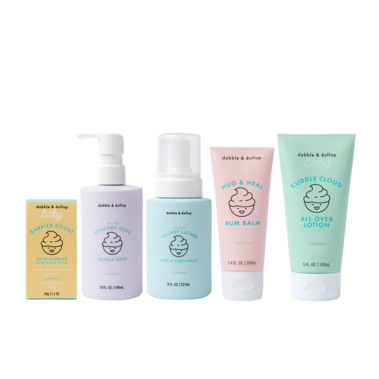The Dabble & Dollop Bundle of Joy Gift Set features five gentle, pastel-colored baby essentials—skin balm, bubble bath, hair and body wash, bum balm, and all-over lotion—ideal for a fragrance-free baby care gift.
