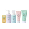 The Dabble & Dollop Bundle of Joy Gift Set features five gentle, pastel-colored baby essentials—skin balm, bubble bath, hair and body wash, bum balm, and all-over lotion—ideal for a fragrance-free baby care gift.
