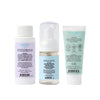 Three Dabble & Dollop Bundle of Joy Minis Kit bottles with pastel labels are shown backward, displaying usage directions and ingredients. The kit includes a white cap bottle, a clear pump bottle, and a white tube for gentle baby skincare.