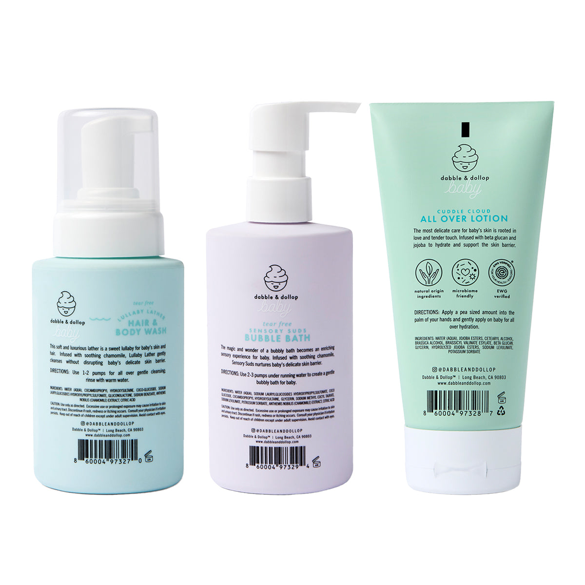 The Baby Bath to Bed Gift Set from Dabble & Dollop includes three pastel-colored bath and body essentials—a foaming hair & body wash, a pump bottle of bubble bath, and a tube of all over lotion—each featuring black text and the brand’s simple logo. Specially formulated for sensitive baby skin, this fragrance-free set is the perfect gentle everyday baby bath gift.