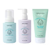 The Dabble & Dollop Baby Bath to Bed Gift Set includes three fragrance-free products—a pump bottle of hair and body wash, a pump bottle of bubble bath, and a squeeze tube of all-over lotion—all featuring minimal pastel packaging with a cheerful baby face logo, making them perfectly gentle for sensitive baby skin.