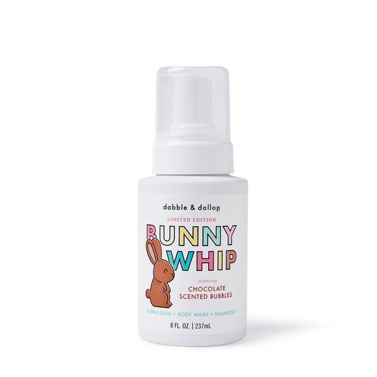 A white bottle of Dabble & Dollop Chocolate Bunny Whip, a limited-edition chocolate-scented 3-in-1 shampoo, bubble bath, and body wash for kids, featuring a cute bunny illustration and foaming pump. Perfect for Easter fun!.