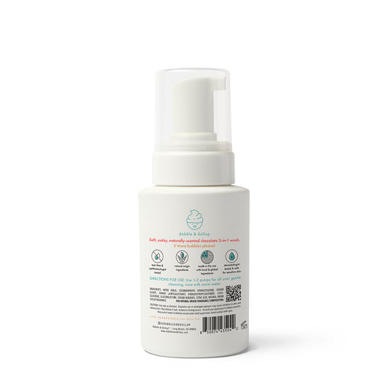 The S'more Bath Set by Dabble & Dollop features a white pump bottle of foaming baby wash with a minimalist, eco-friendly label; safety icons and usage directions are included, making it perfect for any kids’ bath collection.