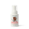 A white bottle of Dabble & Dollop S'more Bath Set features an illustration of a smiling chocolate bar with marshmallows on the label.