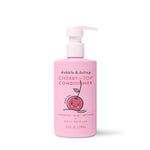 A pink bottle of Dabble & Dollop Cherry on Top® Hair Conditioner with a pump, cute smiling cherry illustration, and text highlighting detangling benefits and a 10 fl oz (296 mL) size.