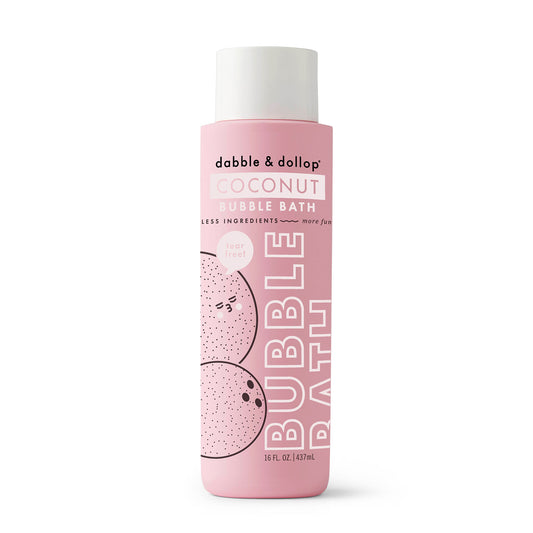 A 16 fl oz (473 ml) pink bottle of Dabble & Dollop Coconut Bubble Bath, decorated with playful coconut illustrations, highlights its gentle, tear-free formula for sensitive skin—made with fewer ingredients for extra fun.
