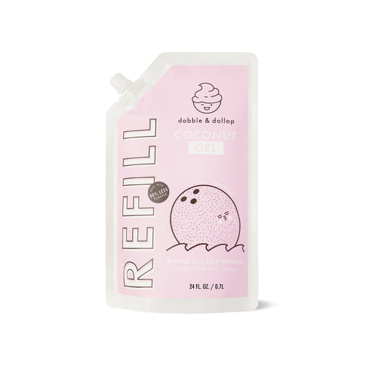 The Dabble & Dollop Coconut Refill pouch showcases a cute coconut illustration and primarily pink and white design. It contains 24 fl oz (710 mL) of eco-friendly gel, perfect for fans of foaming bath products!.