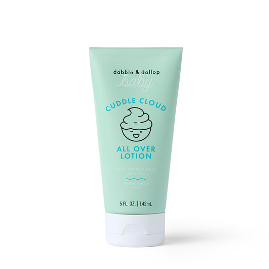 A light green tube of Dabble & Dollop Cuddle Cloud™ All Over Lotion stands upright on a white background, featuring a cute cloud illustration and product details.
