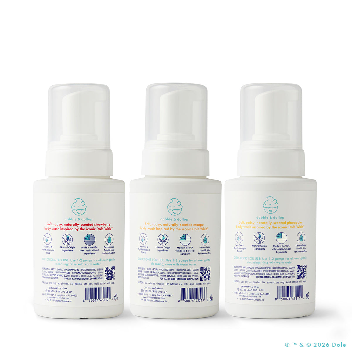 Three white pump-top bottles of Dabble & Dollop's Dole Whip® Foaming Body Wash Bundle are arranged together, each with a baby icon, colorful scent names—strawberry, orange, and peach—and hypoallergenic labels showing product info.