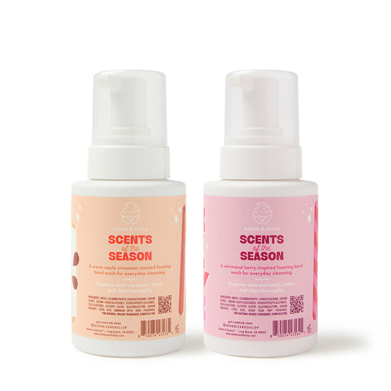 Discover the Dabble & Dollop Sugar, Spice & Suds Foaming Hand Wash Gift Set, featuring two bottles crafted with natural origin fragrances—one in a warm apple cinnamon scent and the other in a whimsical berry-jam scent. This charming seasonal set comes adorned with white pumps and pastel-colored labels, adding a festive touch to any space.