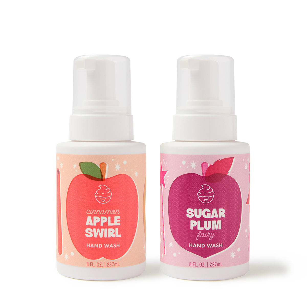 The Dabble & Dollop Sugar, Spice & Suds Foaming Hand Wash Gift Set includes two 8 fl. oz. bottles—one in Cinnamon Apple Swirl featuring a red apple graphic and the other in Sugar Plum Fairy with a purple plum design. Both come with white pump tops and contain natural origin fragrances, making this set a perfect seasonal gift.