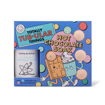 The Dabble & Dollop Totally Tub-ular Tidings Bubble Bath Set comes in a blue gift box with festive cartoon chocolate and marshmallow characters, featuring four hot chocolate bath bombs and a jar of vanilla whip bubble bath.