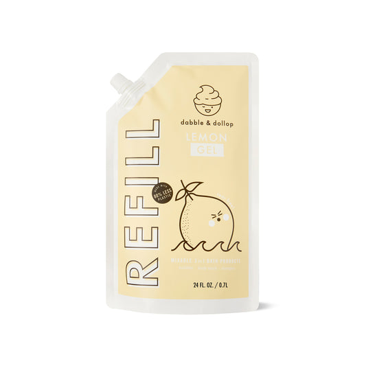 A 24 fl oz lemon refill pouch from Dabble & Dollop, featuring light yellow packaging with a lemon and droplet design. Its labeled as a Miracle 3-in-1 Foaming Bath Product, ideal for ages 0 to 6, and comes in an earth-friendly format.