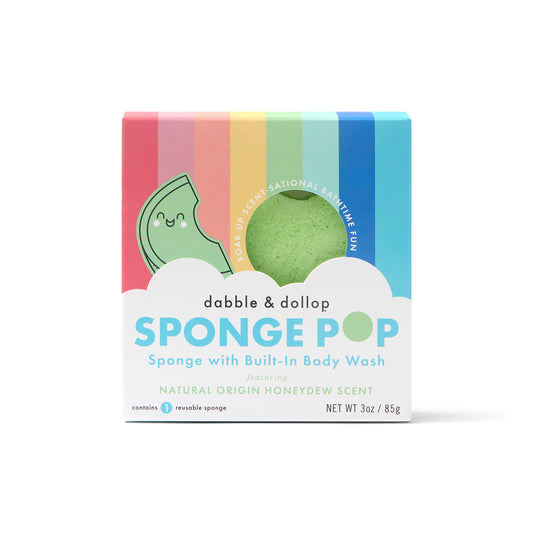 Dabble & Dollop Sponge Pop™ Sponge with Built-In Body Wash features a green, smiling honeydew sponge in a rainbow box. Text highlights “natural origin honeydew scent.” Net wt. 3 oz / 85g.