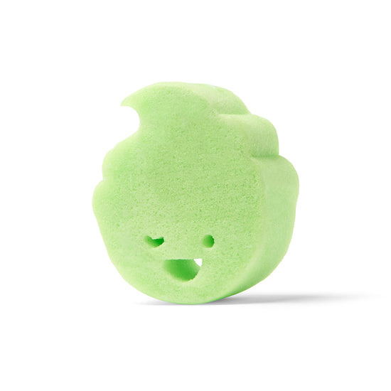 The Dabble & Dollop Sponge Pop™ Sponge with Built-In Body Wash is a light green, flame-shaped bath toy with a smiling face—fun and sensory-friendly for kids.