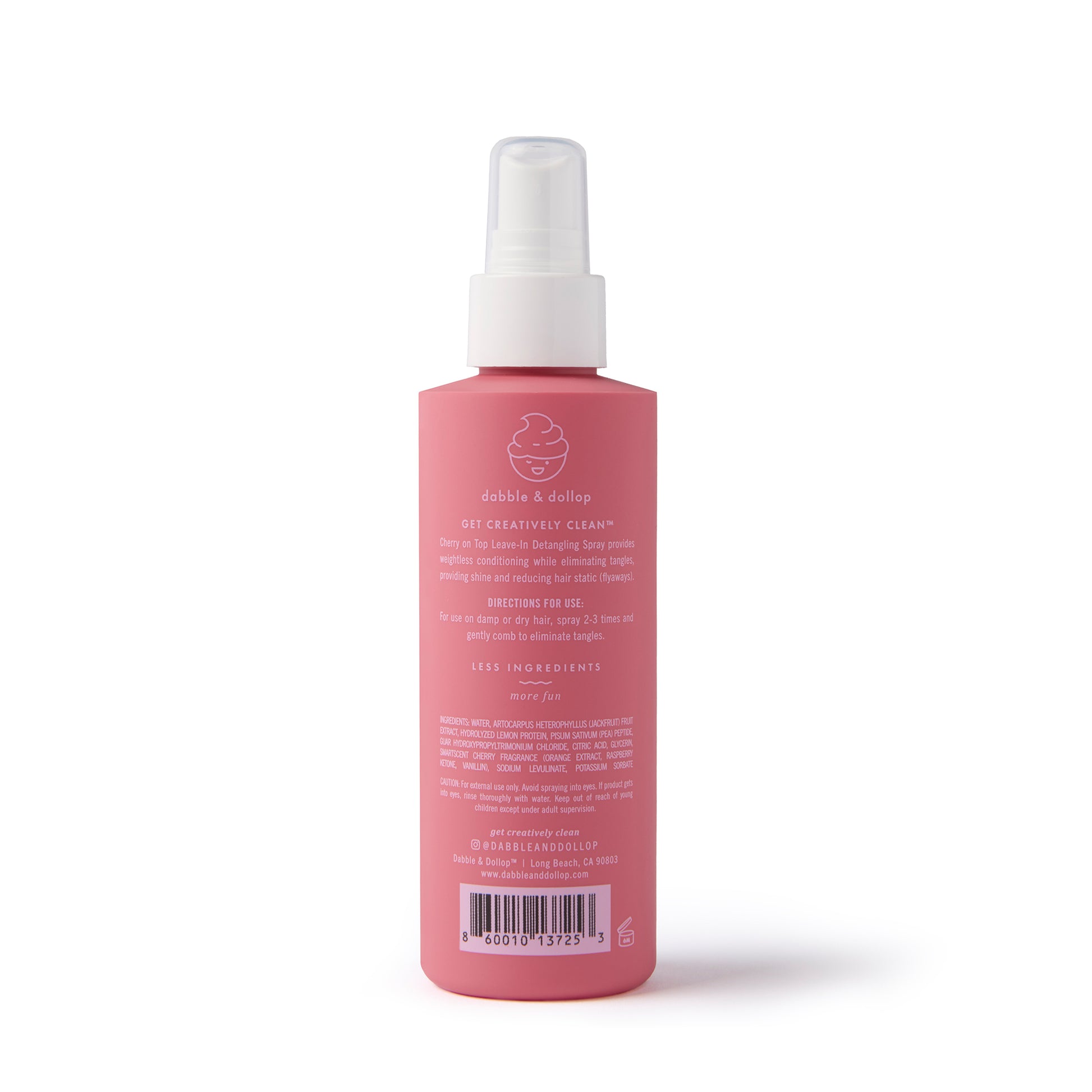 A pink spray bottle labeled "Cherry on Top Leave-In Spray Detangler" by Dabble & Dollop, ideal for kids' hair care. Features a white spray top with directions and ingredients—perfect as a gentle detangling spray. Stands upright on a white background.